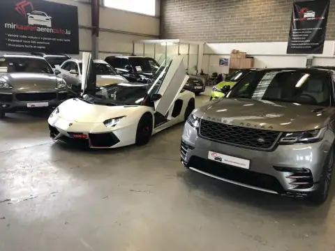 Lamborghini Porsche Range Rover Showroom